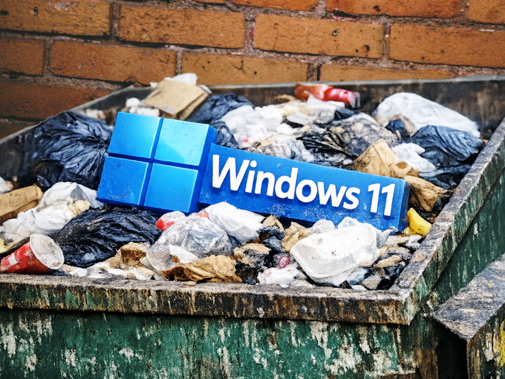 Windows-logo in een afvalcontainer. (Beeldbron: ChatGPT Image 1.5; Anastase Maragos op Unsplash; bewerkt)