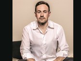Een portretfoto van GameStop CEO Ryan Cohen