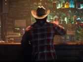 Een screengrab van Wolverine in flanel en cowboyhoed uit de aankondigingstrailer van Marvels Wolverine (bron: PlayStation YT)