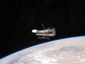 Een afbeelding van de Hubble ruimtetelescoop in een baan om de aarde (Afbeeldingsbron: NASA; bijgesneden)