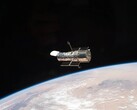 Een afbeelding van de Hubble ruimtetelescoop in een baan om de aarde (Afbeeldingsbron: NASA; bijgesneden)