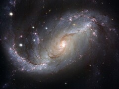 Een afbeelding van het sterrenstelsel NGC 1672 en sterren in het heelal. (Afbeeldingsbron: WikiImages - Pixabay)