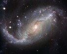 Een afbeelding van het sterrenstelsel NGC 1672 en sterren in het heelal. (Afbeeldingsbron: WikiImages - Pixabay)