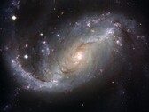 Een afbeelding van het sterrenstelsel NGC 1672 en sterren in het heelal. (Afbeeldingsbron: WikiImages - Pixabay)