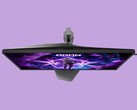 De afbeelding toont de AOC AG276UZ-gamingmonitor tegen een paarse achtergrond. De gamingmonitor heeft een uitgesproken gamingontwerp, compleet met RGB-verlichting aan de achterzijde.