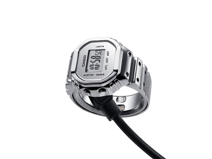 Casio CRW-H001M-8 Smart Ring Watch aangesloten op de magnetische USB-oplaadkabel.