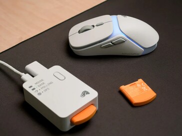 Wit Glorious Model O3 Wireless met de multifunctionele basis en reservebatterij. (Afbeeldingsbron: Glorious)