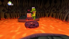 Croc Legend of the Gobbos screenshot met Croc die over lava springt
