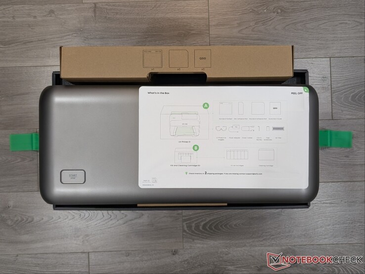 E1 UV-printer in doos met installatie-instructies.