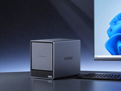 De N3A heeft vier SATA-schijfnissen en twee M.2 SSD-sleuven. Afgebeeld: een promofoto van de NAS naast een monitor.