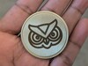 SVG-ontwerp op koperen munt met fiberlaser.