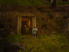 Afgebeeld - een screenshot uit de trailer van Swordhaven: Iron Conspiracy, waarin de hoofdpersoon een zwaard vasthoudt voor een mijningang. (Afb. bron: Steam)