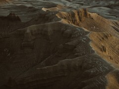 Een decoratieve afbeelding. Afgebeeld is een luchtfoto van een berg (Afbeelding bron: Harrison Steen via Unsplash; bijgesneden)