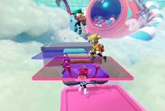 Popucom screenshot met personages op platforms in wolken die puzzels oplossen