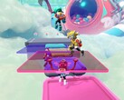 Popucom screenshot met personages op platforms in wolken die puzzels oplossen