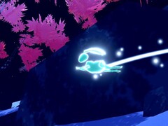 Afgebeeld: Een gloeiend konijn huppelt over de bosgrond bij een rots en kersenbloesembomen (Bron: Screenshot binnen Studio Gauntlet's Sno: Ultimate Freeriding)