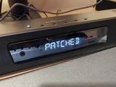 Een afbeelding van de Creative Katana V2X met de tekst "Patched" erop.