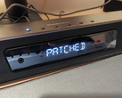 Een afbeelding van de Creative Katana V2X met de tekst "Patched" erop.