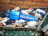 Windows-logo in een afvalcontainer. (Beeldbron: ChatGPT Image 1.5; Anastase Maragos op Unsplash; bewerkt)