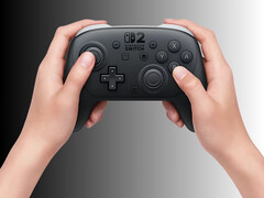 Nintendo Switch 2 Pro Controller onderworpen aan teardown getoond in handen (Afbeelding bron: Nintendo of America met bewerkingen)