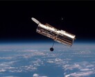 Een afbeelding van de Hubble ruimtetelescoop in een baan om de aarde (Afbeeldingsbron: ESA; bijgesneden)