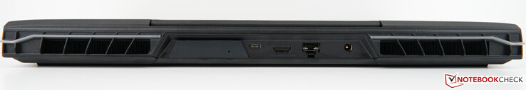 Achterkant: Sleuf voor XMG OASIS (met afdekking), USB-C 3.2 Gen 2×1 (DisplayPort 1.4a), HDMI 2.1 (G-SYNC compatibel, HDCP 2.3), RJ45-poort 2,5 Gb/s (LAN), netstroomadapter