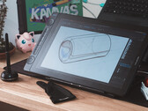 Huion Kamvas 16 Gen 3 op bureau met stylus, tekenhandschoen en toetsenbord