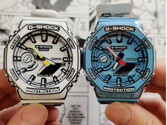Afgebeeld - de Casio G-Shock GA-2100MNG-2A (rechts) en GA-2100MNG-7A (links). 