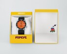 Seiko 5 Sports x Popeye HDB013 automatisch horloge met een oranje wijzerplaat, naast de gele presentatiedoos in beperkte oplage.