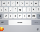Een afbeelding van het iOS-toetsenbord met het emoji-symbool vervangen door de boze emoji van iOS.