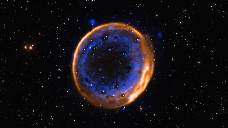 Beeld van de dubbele-detonatiesupernova SNR 0509-67.5 zoals gezien door de VLT. (Beeldbron: ESO/P. Das et al. Achtergrondsterren (Hubble): K. Noll et al.)