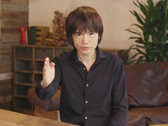 Nintendo-ontwerper Masahiro Sakurai aan tafel (bron: The Guardian)