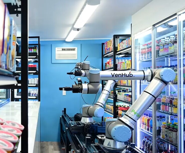 Venhub-winkels gebruiken twee AI-gestuurde robots die op een lange metalen baan rijden om 24/7 bestellingen van klanten in te vullen. (Afbeeldingsbron: Venhub)
